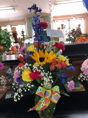 Graduations Bright Pinwheel Bouquet — Graduations floral arrangement by Long's Florist